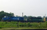 CSX 7307 leads a train out of the yard